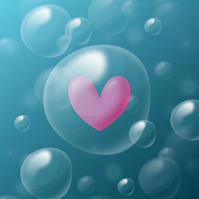Bubblor under vattnet där en har ett hjärta innuti sig.